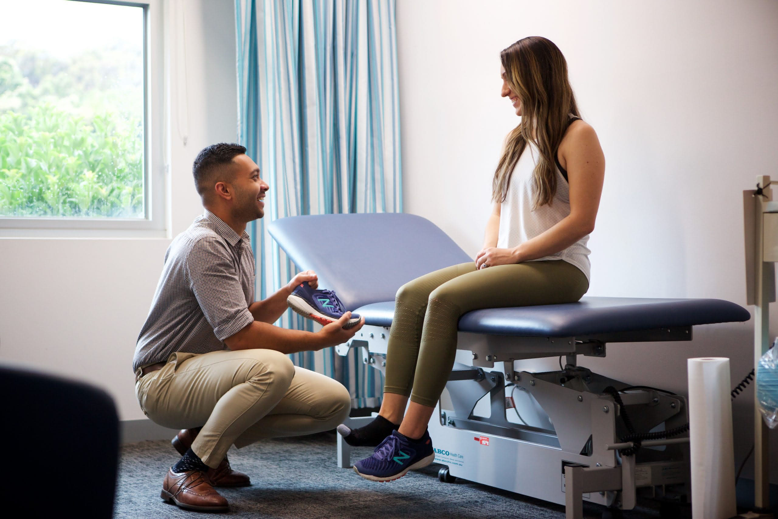 Podiatrist consulting with patient about footwear